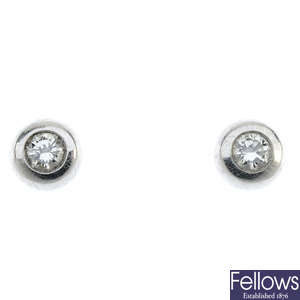 A pair of brilliant-cut diamond collet ear studs.