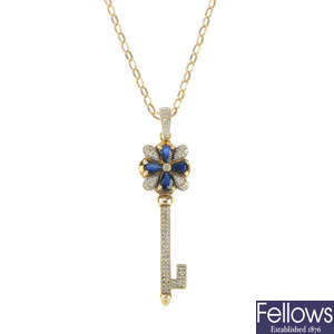 A 9ct gold diamond and sapphire key pendant.