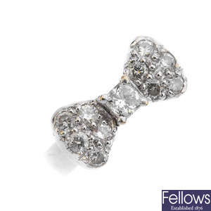 A diamond and laser-drilled diamond bow ring.
