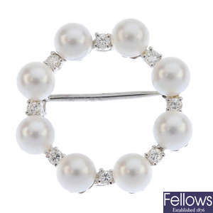 A cultured pearl and diamond wreath brooch.