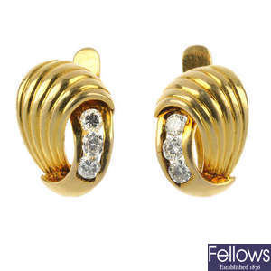 A pair of diamond earrings. 