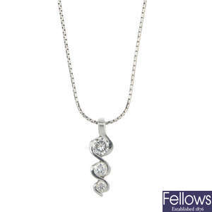 An 18ct gold diamond three-stone necklace. 