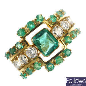 An emerald and diamond ring.