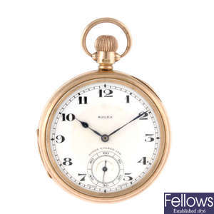 An open face 9ct gold pocket watch by Rolex together with a 9ct gold chain and shield fob.
