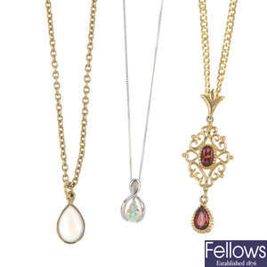 A selection of three 9ct gold gem-set pendants. 