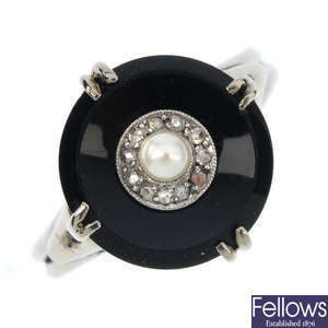 An onyx, cultured pearl and diamond ring.