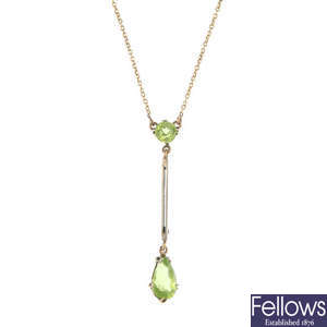 An early 20th century platinum and 9ct gold peridot pendant.