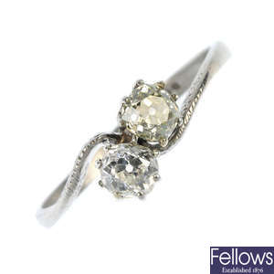 A platinum diamond two-stone crossover ring.