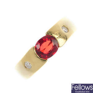 A synthetic ruby and diamond three-stone ring. 