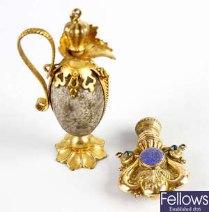 A late 19th century gilt-metal mounted novelty scent bottle, plus another similar. 