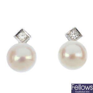 A pair of cultured pearl and diamond ear studs.