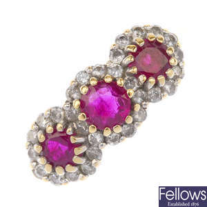 An 18ct gold ruby and diamond triple cluster ring.