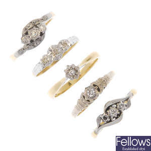 A selection of five mostly mid 20th century platinum and 18ct gold diamond rings. 