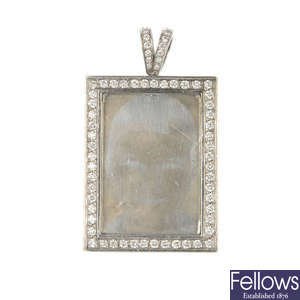 A diamond double-sided portrait pendant. 