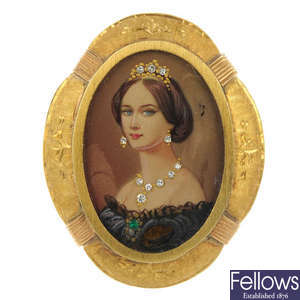 An 18ct gold diamond and emerald miniature portrait brooch.