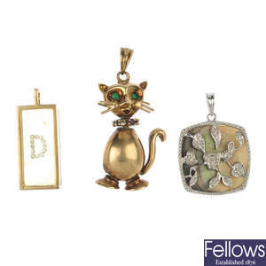 A selection of three 9ct gold gem-set pendants.
