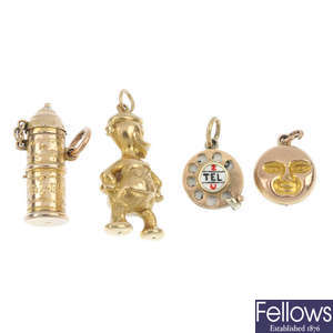 A selection of four early to mid 20th century 9ct gold charms.