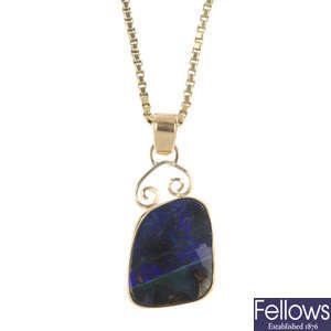 A boulder opal pendant and a chain.