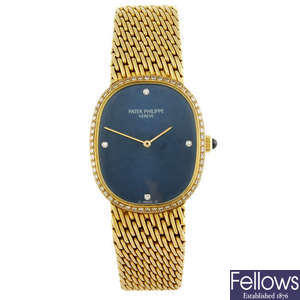 PATEK PHILIPPE - a gentleman's 18ct yellow gold Ellipse bracelet watch.

