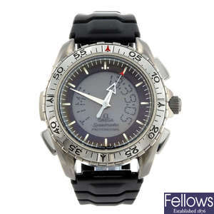 OMEGA - a gentleman's titanium Speedmaster Professional wrist watch.