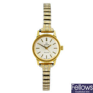 OMEGA - a lady's gold plated Genève bracelet watch.