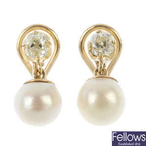 A pair of diamond and cultured pearl ear pendants.