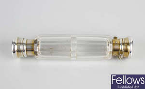 A clear glass dual scent bottle