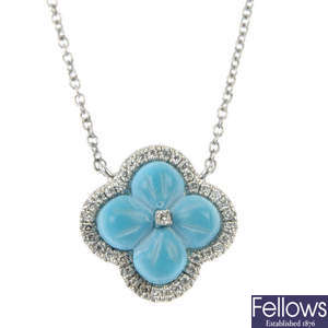 A turquoise and diamond quatrefoil pendant.
