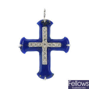 A lapis lazuli and diamond cross pendant.