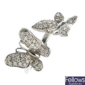 A diamond butterfly ring.