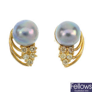 A pair of cultured pearl and diamond ear studs.
