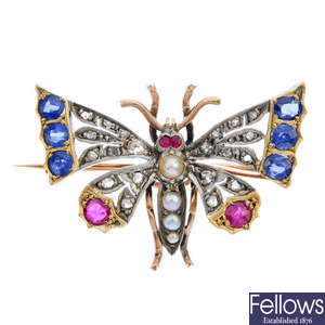 A late 19th century silver and gold, diamond and gem-set butterfly brooch.