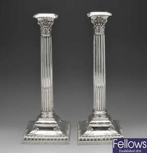 A pair of late Victorian silver candlesticks.