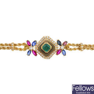 An 18ct gold emerald, sapphire, ruby, garnet and diamond bracelet.