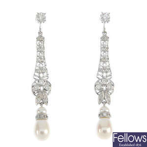 A pair of cultured pearl and diamond ear pendants.