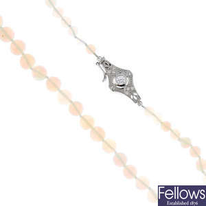 An opal single-strand necklace, with diamond clasp.