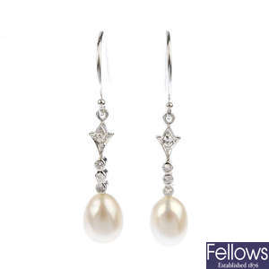 A pair diamond and freshwater cultured pearl ear pendants.
