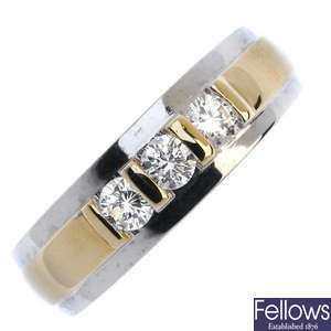 An 18ct gold diamond three-stone band ring.