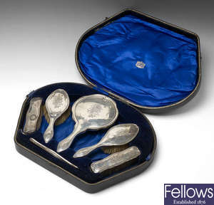An early 20th century silver mounted dressing table set in fitted case.