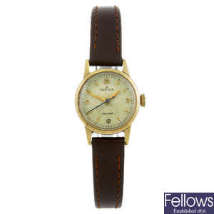 ROLEX - a lady's yellow metal Precision wrist watch.