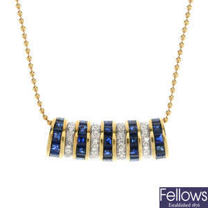 A sapphire and diamond pendant with bead-link chain.