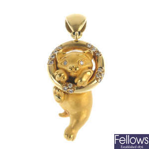 A diamond novelty cat pendant.
