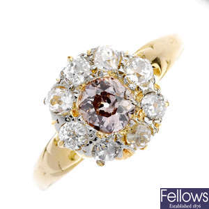 A 'pinkish-brown' diamond and diamond cluster ring. 