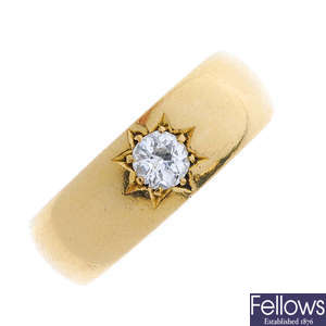 A late Victorian diamond single-stone band ring.