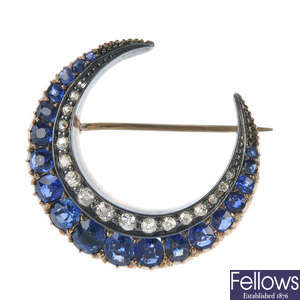 A late 19th century century silver and 9ct gold sapphire and diamond crescent brooch.