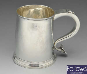 A Queen Anne Britannia silver mug.