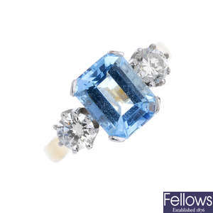 An 18ct gold aquamarine and diamond three-stone ring. 