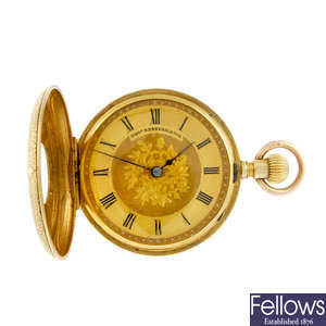 A half hunter pocket watch by Thomas Russell & Son.