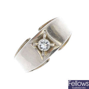A diamond single-stone band ring.