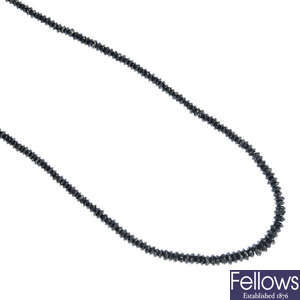 A graduated single-strand gem-set necklace. 